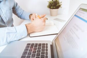 Blog 8 A laptop on a table featuring quickbooks crm integration