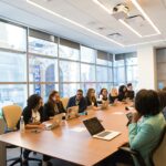 boardroom with people discussing internal controls